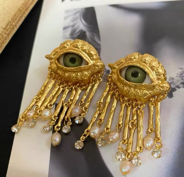 Surreal Dangle Eye Clip On Earrings